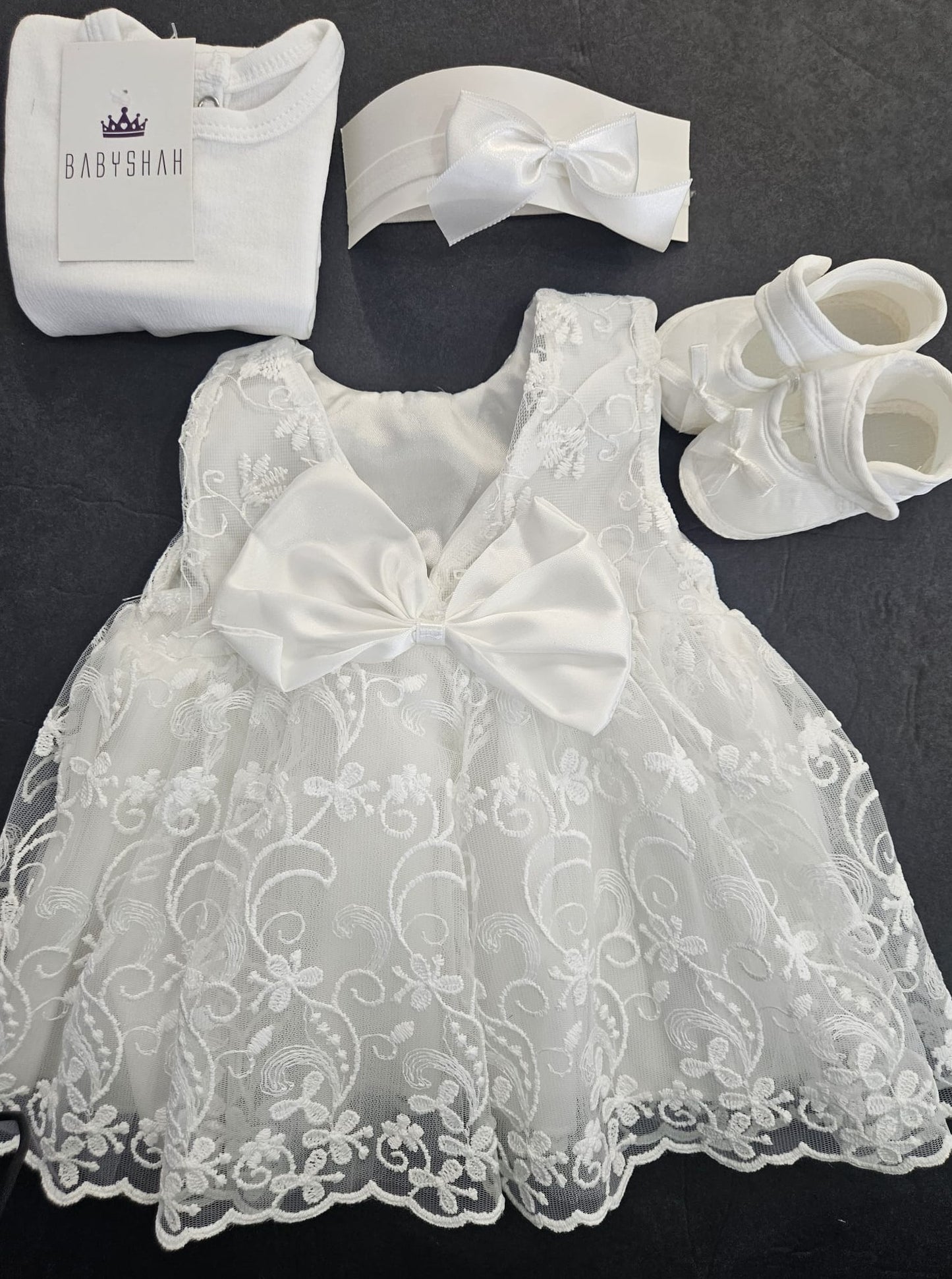 Christening dress by Pugi Baby