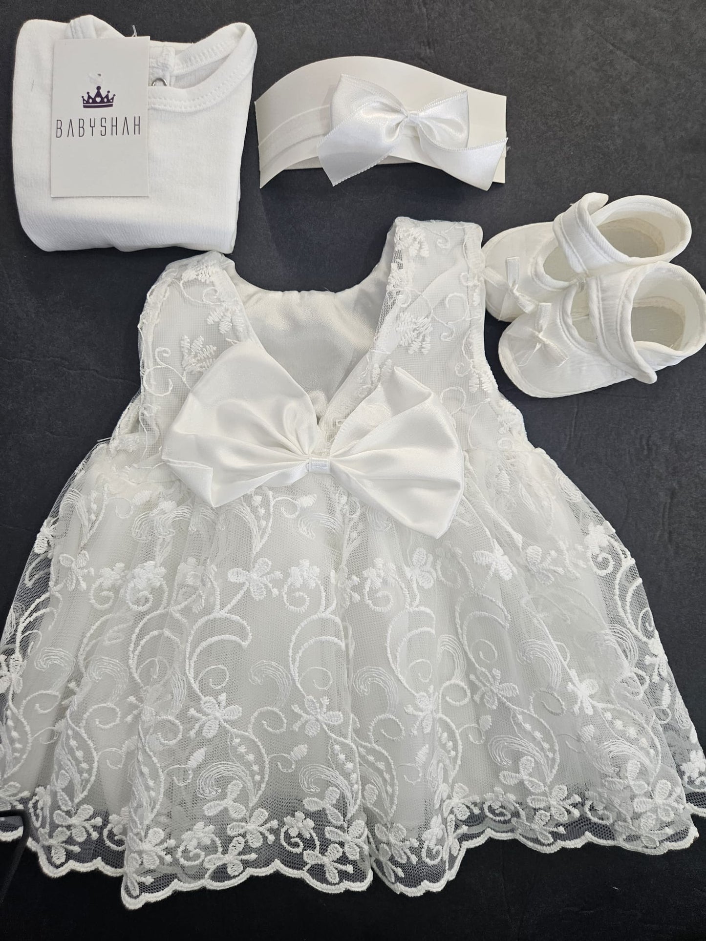 Christening dress by Pugi Baby